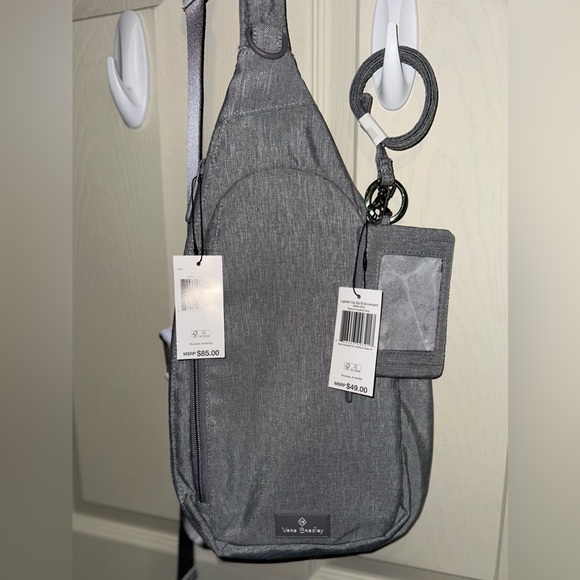 Vera Bradley Handbags - Vera Bradley Gray Sling Backpack with clip zip ID & Lanyard